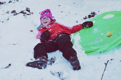 Full length of child on snow covered landscape