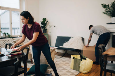 Women sitting on table at home