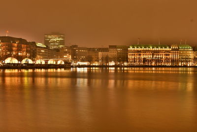 Illuminated city at waterfront