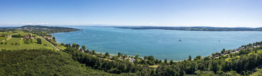 High angle view of townscape by sea against sky