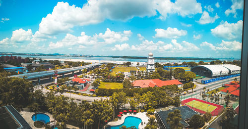 High angle view of swimming pool by sea against sky