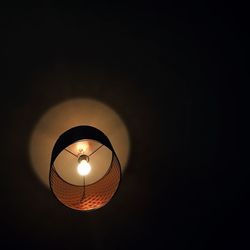 Low angle view of lit lamp