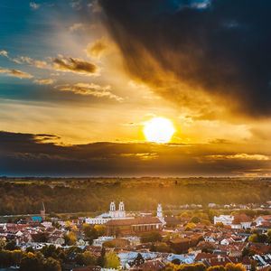 Aerial view of townscape against sky during sunset