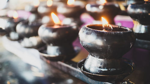 Close-up of illuminated diyas