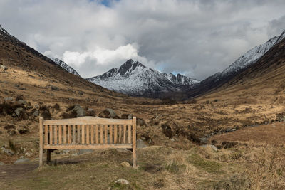 Built structure on snowcapped mountains against sky