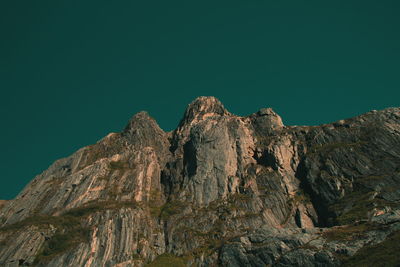 Low angle view of rock formation against sky