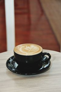 Coffee cup on table