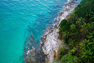 High angle view of rocks by sea