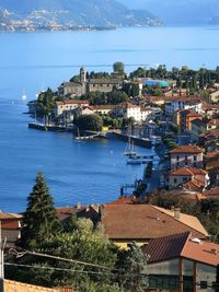High angle view of townscape by sea
