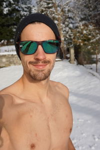 Portrait of young man wearing sunglasses