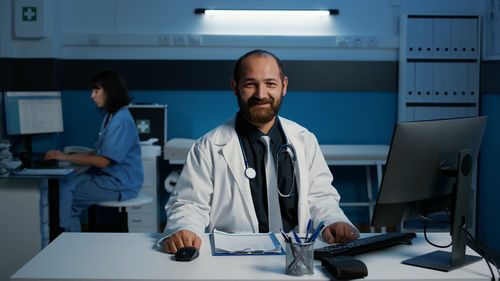 Portrait of doctor working in office