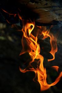 Close-up of fire burning at night