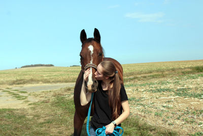 Horse on field against sky