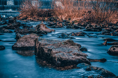 View of river flowing through rocks