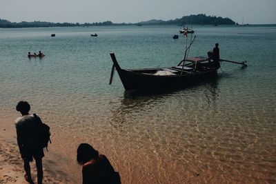 People on boat in sea