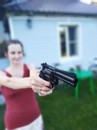 Midsection of woman holding smart phone