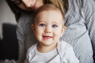 Close-up of mother and daughter at home