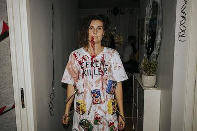 Woman wearing halloween costume looking at camera