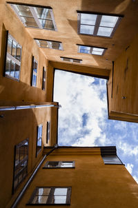 Directly below shot of building against sky