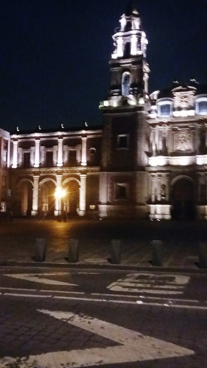 illuminated, building exterior, architecture, built structure, night, street, blurred motion, city, place of worship, outdoors, city life, facade