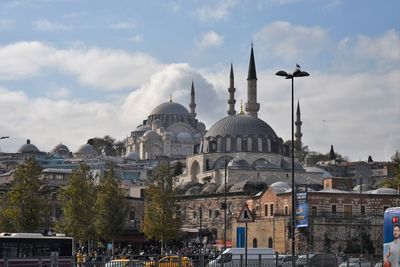 Panoramic view of buildings in city against sky