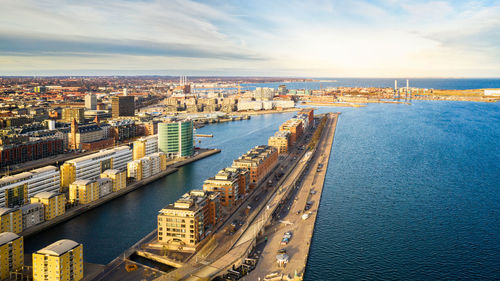 High angle view of river amidst buildings in city