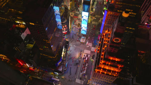 High angle view of illuminated buildings in city at night