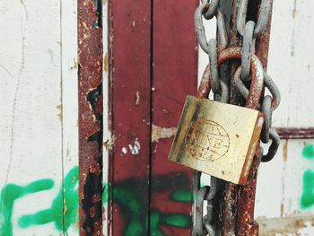 Close-up of padlocks on metal door