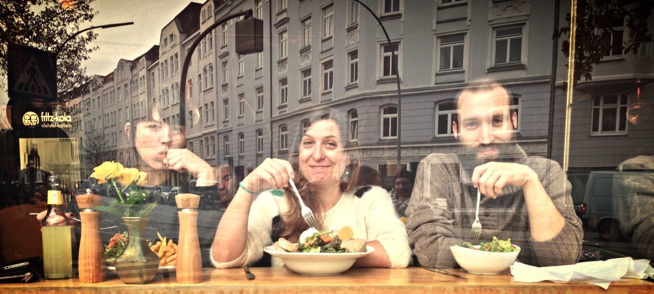 PORTRAIT OF PEOPLE IN FRONT OF BUILDING