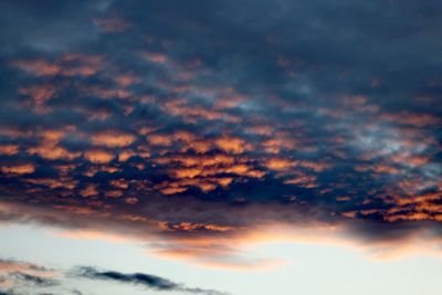 Low angle view of cloudy sky during sunset