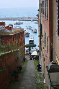 High angle view of buildings by sea against sky