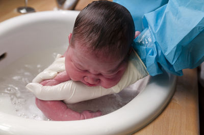 Close-up of baby boy in bathtub