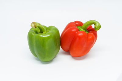 Close-up of bell peppers against white background