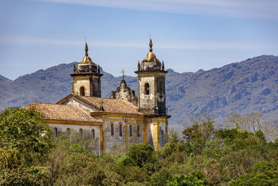 Old colonial-style church in the historic city of ouro preto in minas gerais and its mountains