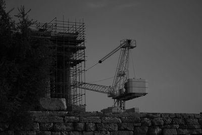Low angle view of crane on the wall