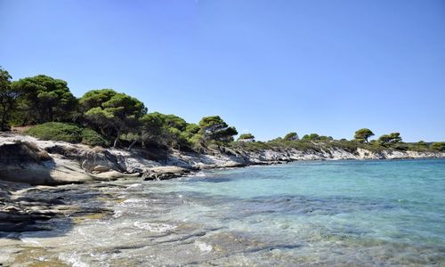 Scenic view of sea against clear blue sky