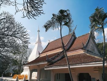 Low angle view of roof and building against sky