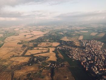 High angle view of buildings in city against sky