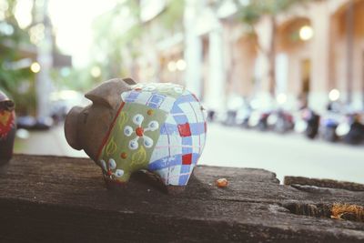 Close-up of umbrella on sidewalk