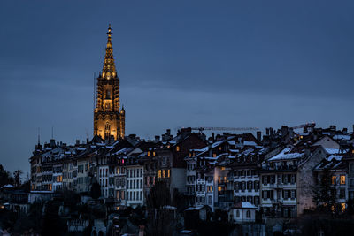 High angle view of illuminated buildings in city at dusk