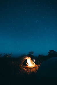 View of bonfire against sky at night