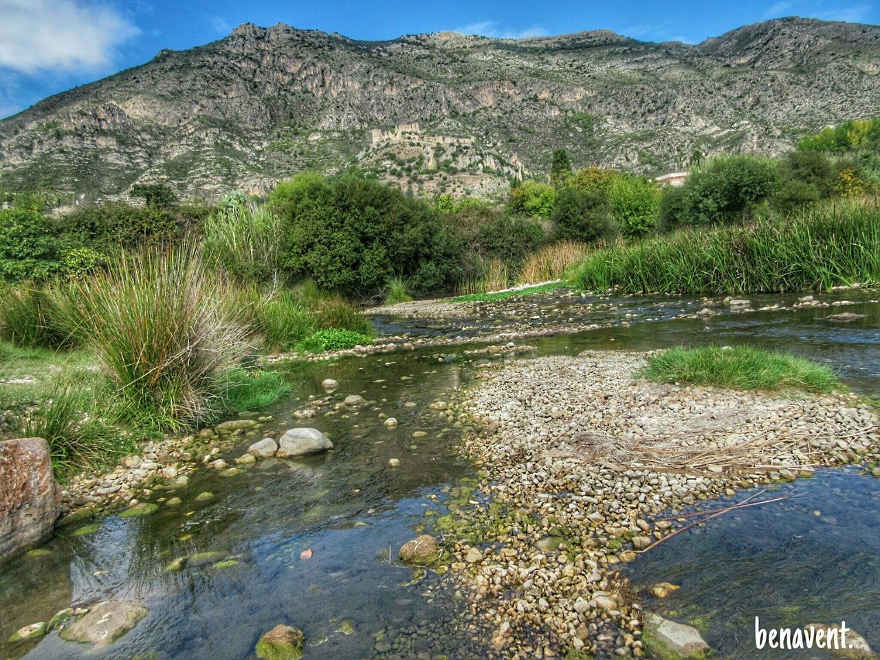 mountain, tranquil scene, tranquility, scenics, mountain range, beauty in nature, nature, water, tree, landscape, sky, non-urban scene, rock - object, rock formation, river, day, idyllic, road, outdoors, no people