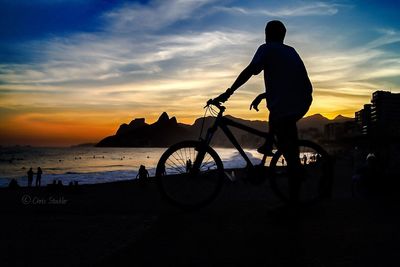 Silhouette of woman at sunset