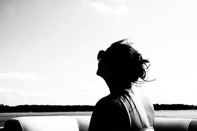 Portrait of silhouette woman standing against sky