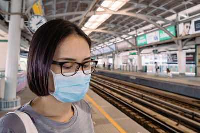 Portrait of woman at railroad station