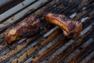 High angle view of meat on barbecue grill