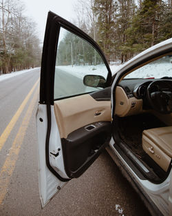 Close-up of car on road