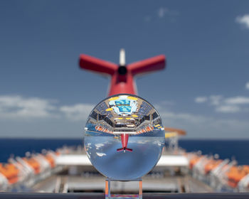 Close-up of airplane against sky