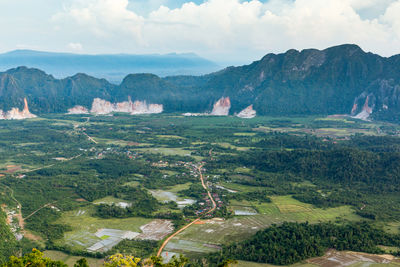 Scenic view of landscape and mountains against sky