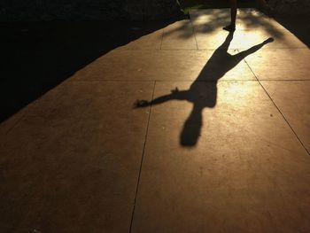 High angle view of silhouette shadow on floor